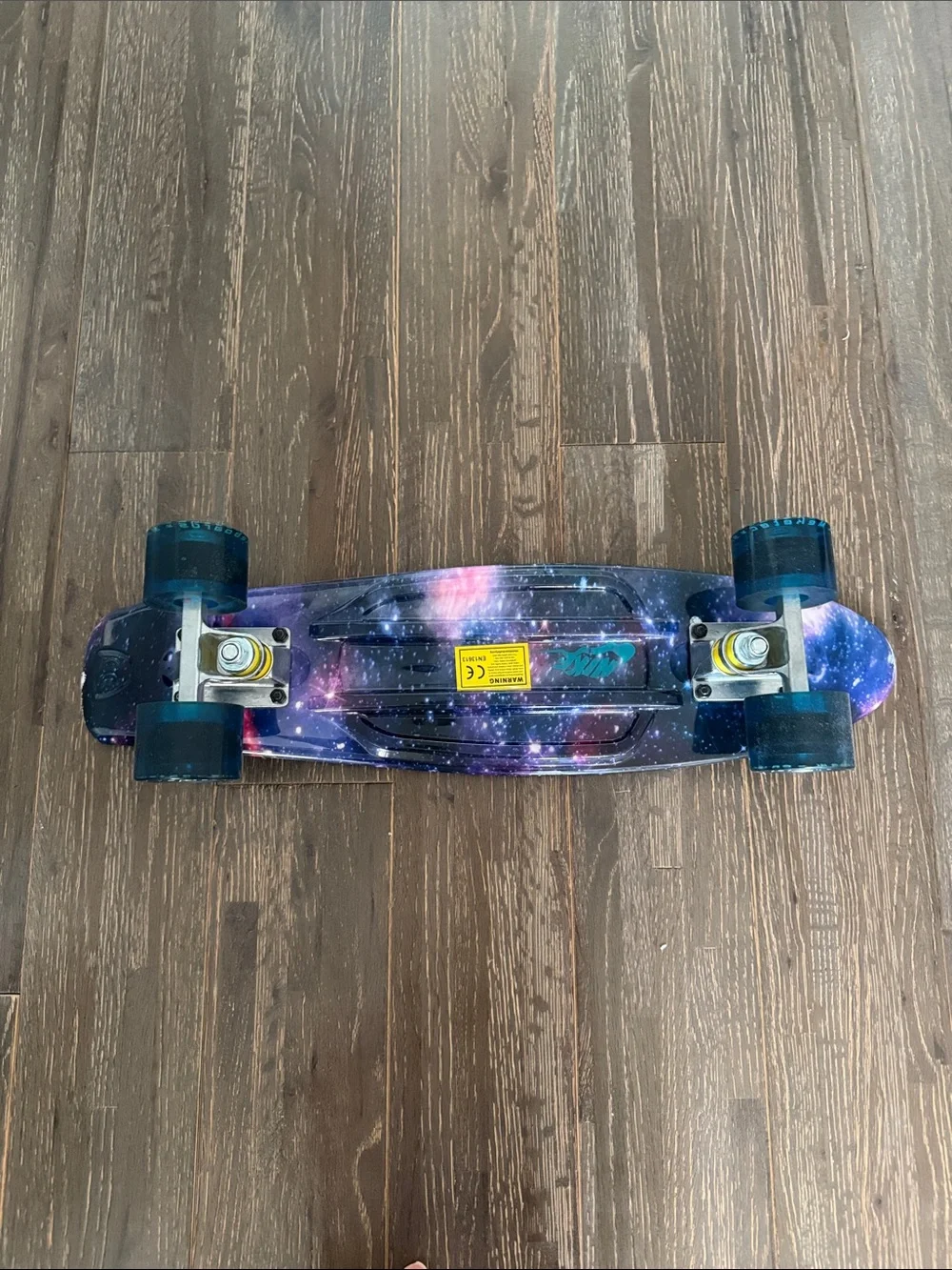 Galaxy Print Skateboard Wall Accent in Purple and Pink